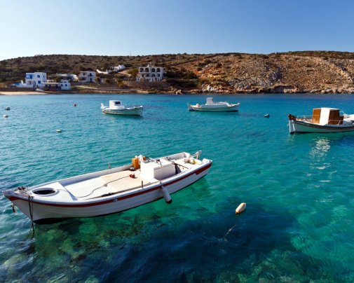 Fishing boats moored in Agios Georgios Bay, the harbor of Iraklia in the Small Cyclades in the Aegean Sea