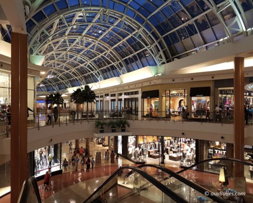 A view of the interior of the Florida Mall with its shops at night