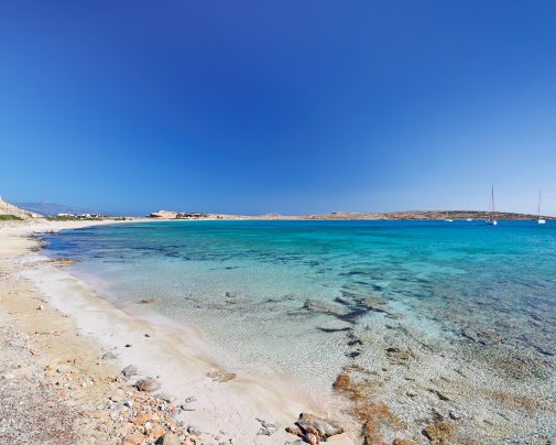 Pori Beach on Koufonissi, lined with white sand and turquoise waters in the Small Cyclades Pori Beach on Koufonissi, lined with white sand and turquoise waters in the Small Cyclades