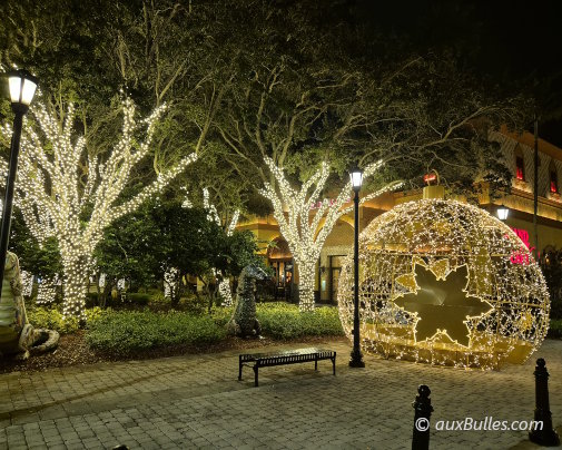 Christmas lights create a warm nighttime atmosphere at Sawgrass Mills