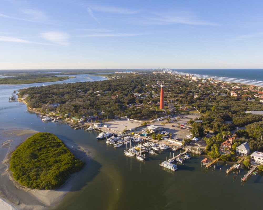 Aerial view of Ponce Inlet Lighthouse, Florida's tallest lighthouse overlooking the Atlantic coast Aerial view of Ponce Inlet Lighthouse, Florida's tallest lighthouse overlooking the Atlantic coast