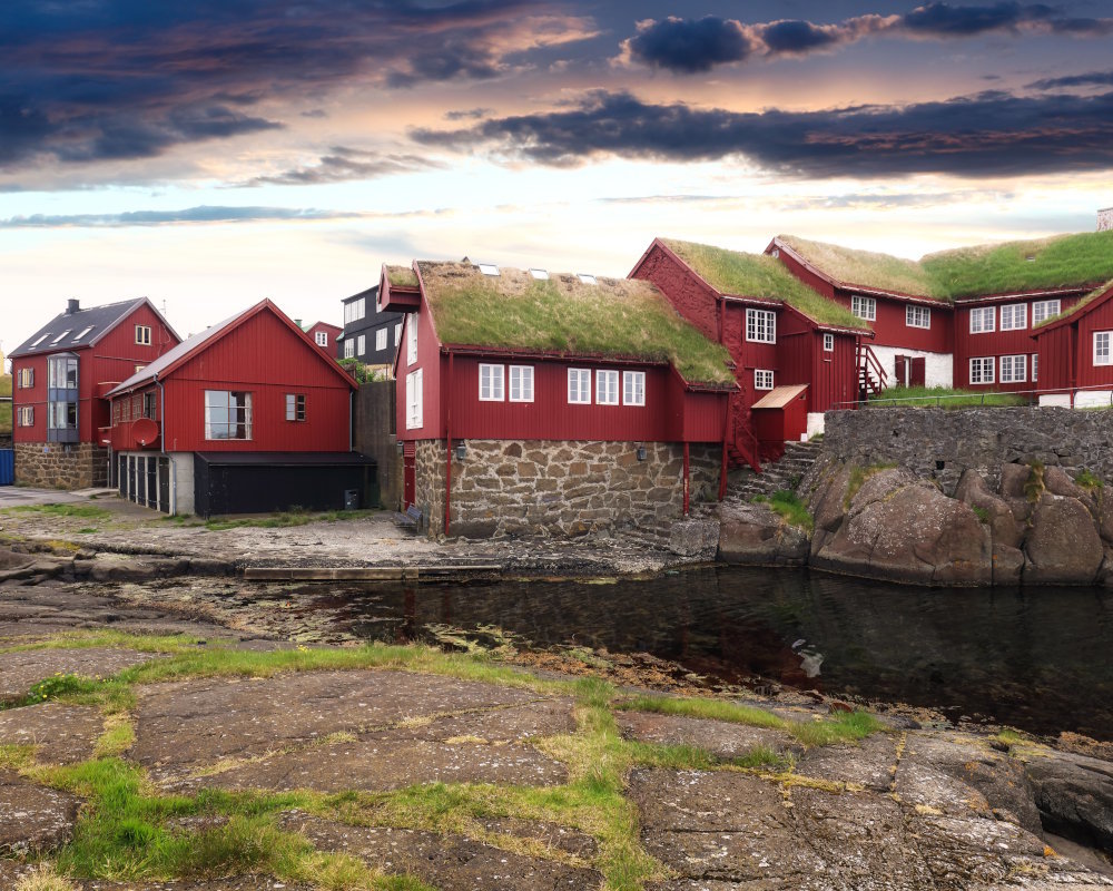 The historic district of Tinganes in Tórshavn, seat of the Parliament of the Faroe islands, with its traditional red houses along the harbor